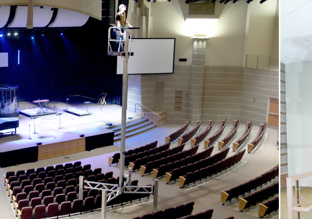 Two scenes showing workers using ReechCraft PowerLift equipment indoors: Left: A large auditorium with rows of seating and a stage under bright spotlights; a worker is elevated high on a PowerLift platform near the ceiling, performing maintenance or installation work. Right: A worker on a PowerLift platform reaching up to adjust ceiling panels in a modern interior space with a railing and light-colored walls.