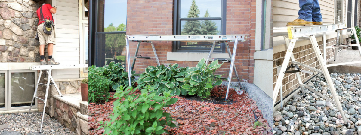 Three views of the three-legged scaffold set up outdoors on uneven surfaces. The left image shows a person standing on the platform while working on siding near a stone wall. The center image displays the platform positioned over mulch and plants in front of a brick wall. The right image shows a close-up of the platform legs adjusted to stabilize on rocky ground, with a person standing on top.