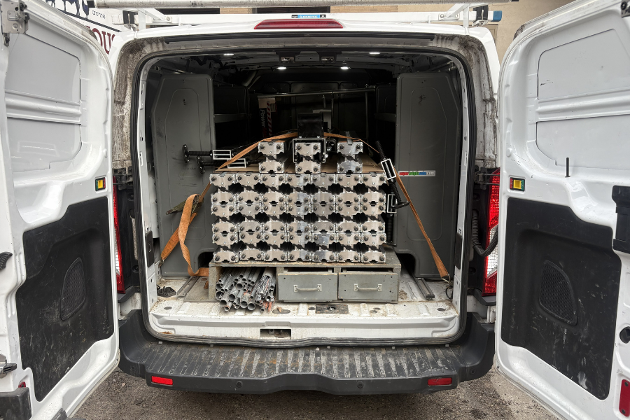 2-Images-Article Want A Lift (2) The PowerLift is shown disassembled in the back of a van.