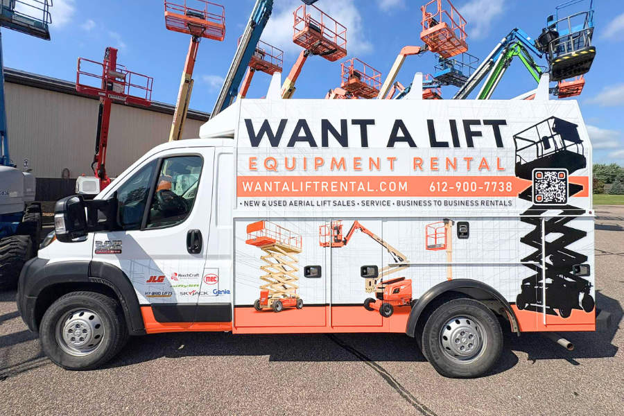 2-Images-Article Want A Lift An orange and white Want A Lift truck is parked in front of various aerial lifts.